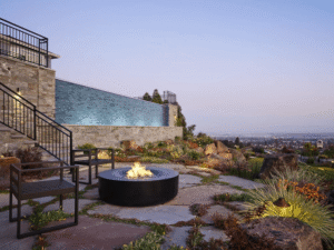 Hillside pool and fire-pit patio designed for outdoor entertaining