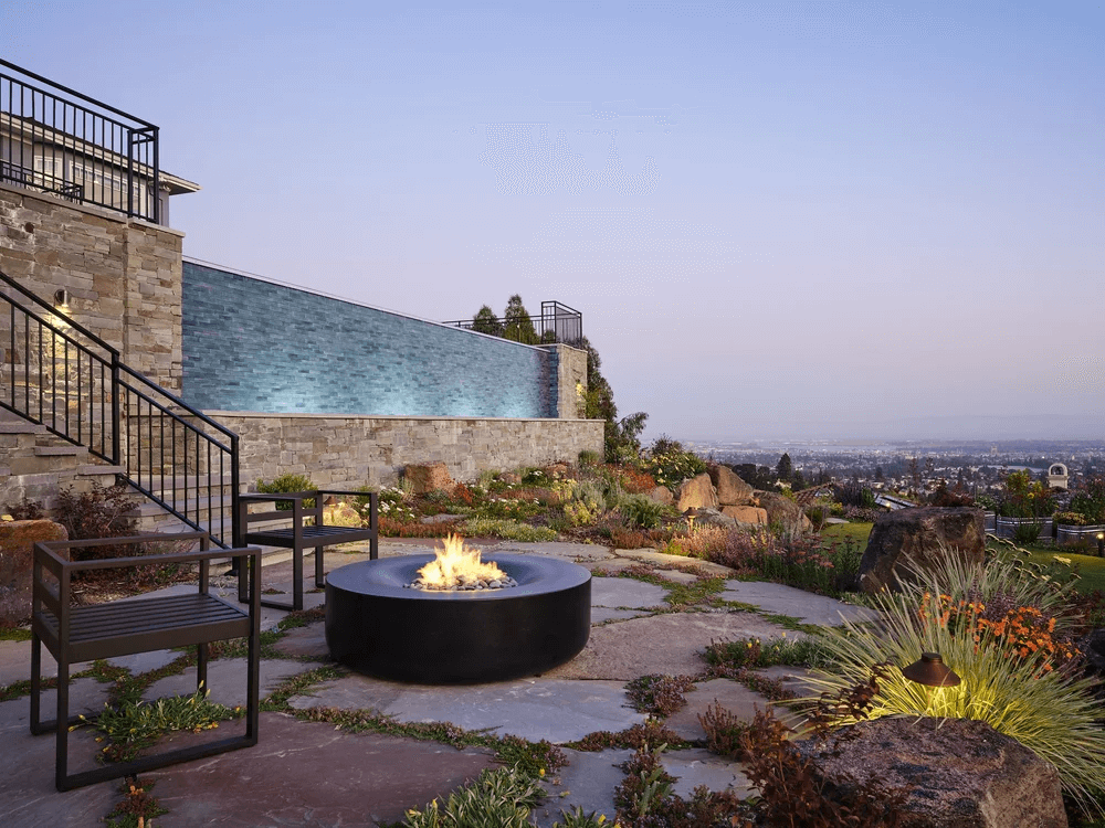 Hillside pool and fire-pit patio designed for outdoor entertaining