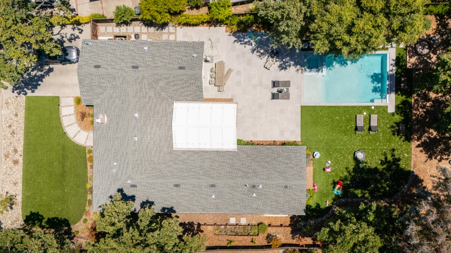 Diablo View custom pool with raised spillover spa and stone paver decking