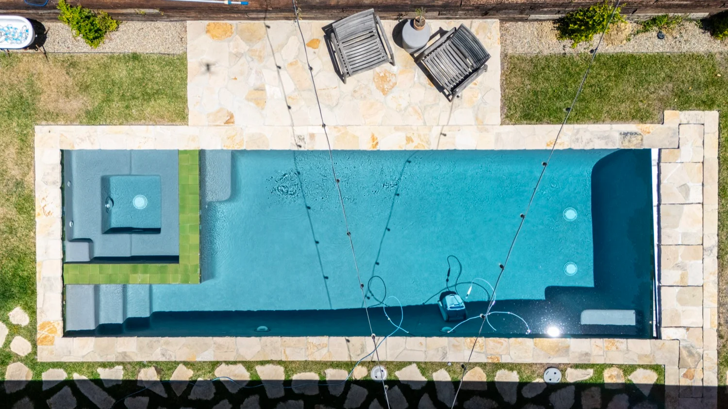 Freeform pool with natural stone decking in Alamo, CA