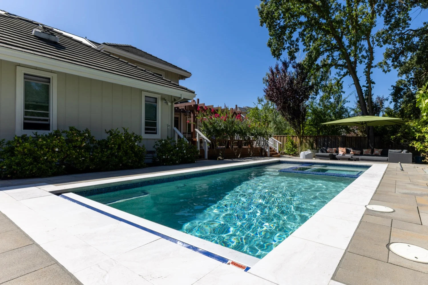 Backyard pool with mature landscaping in Martinez, CA