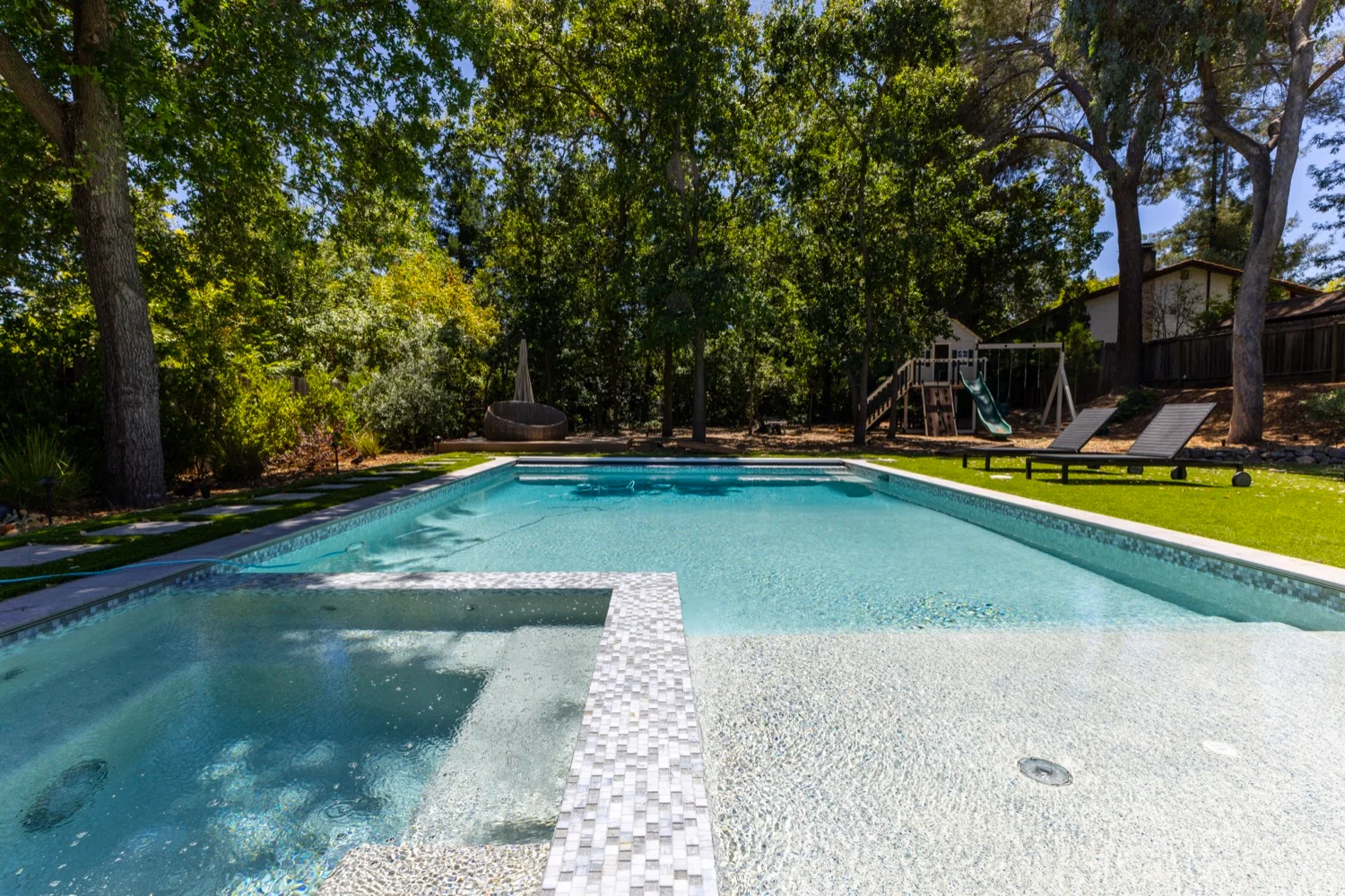 Full-sun family backyard with pool and spa at Diablo View
